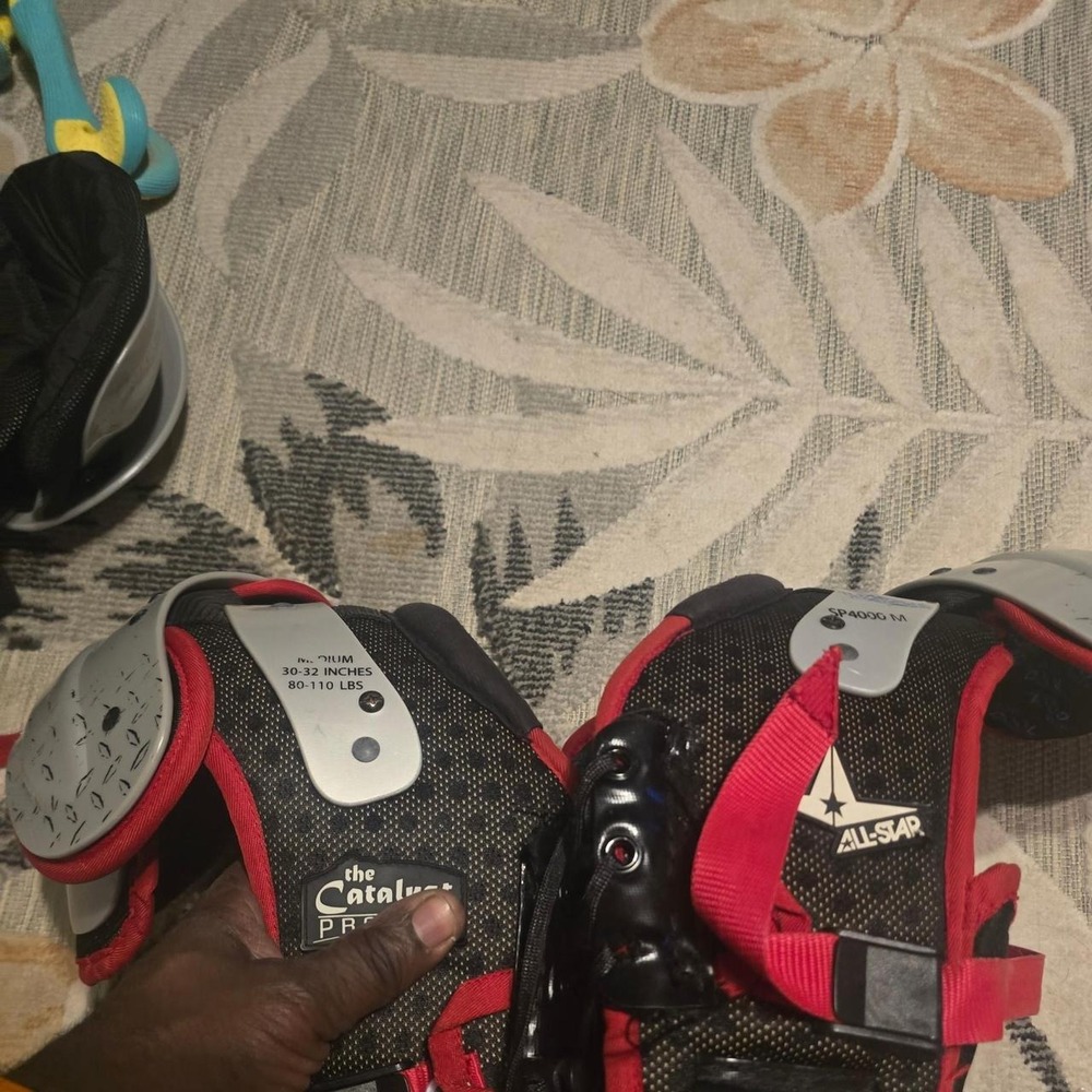 All Star black & red shoulder pads with blue speckled pattern, m